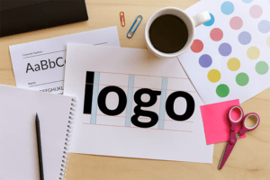 desk workspace with logo design ideas