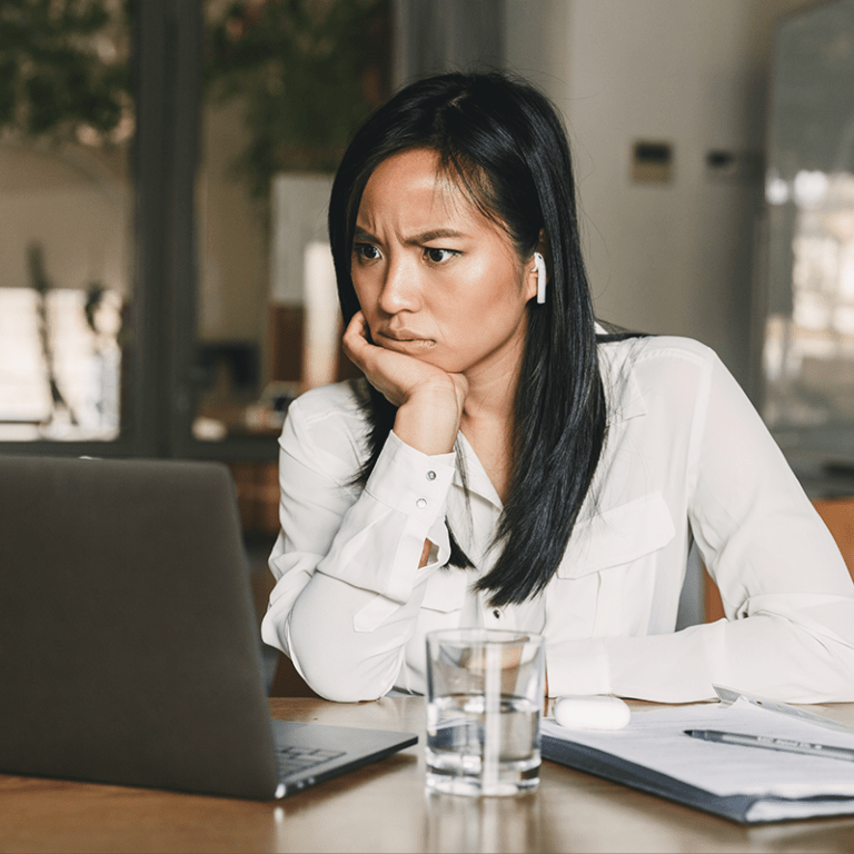 woman confused while working on computer