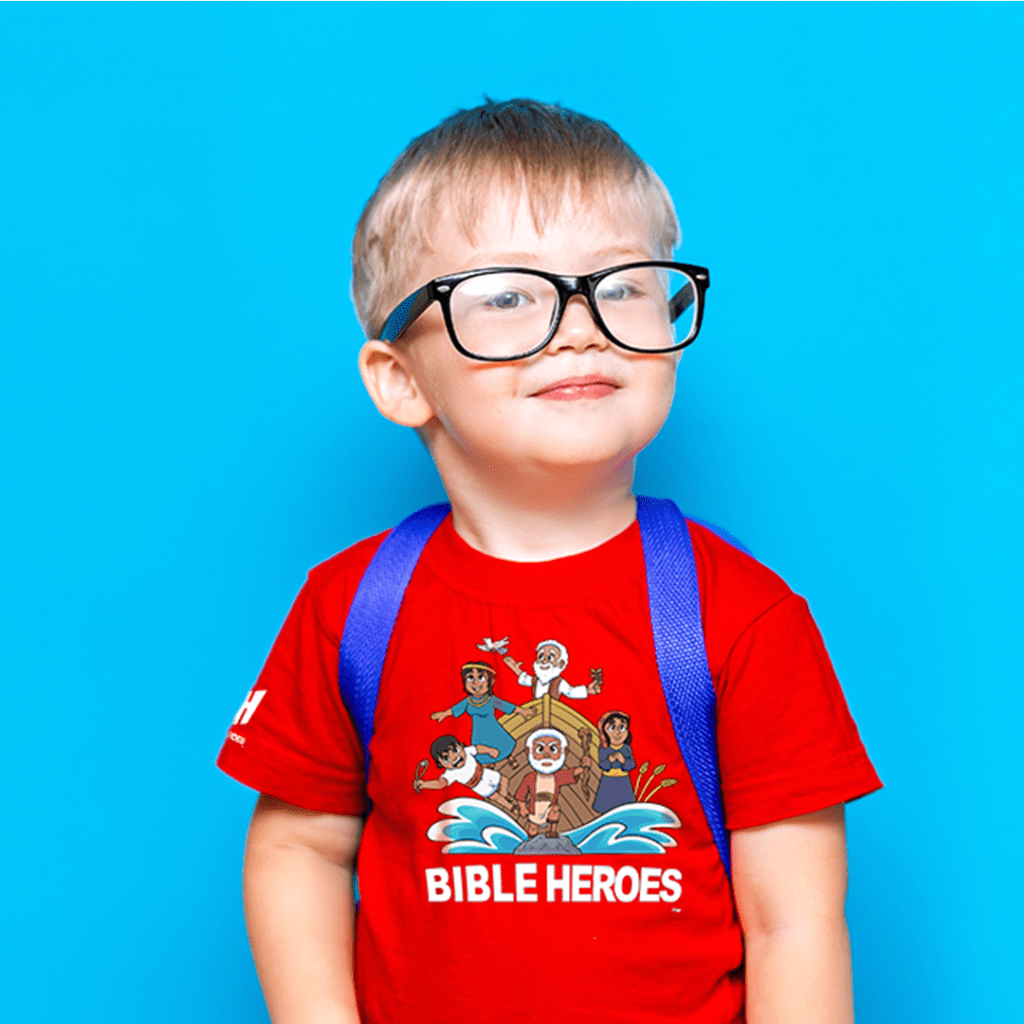 little boy glasses wearing a red Bible Heroes t-shirt