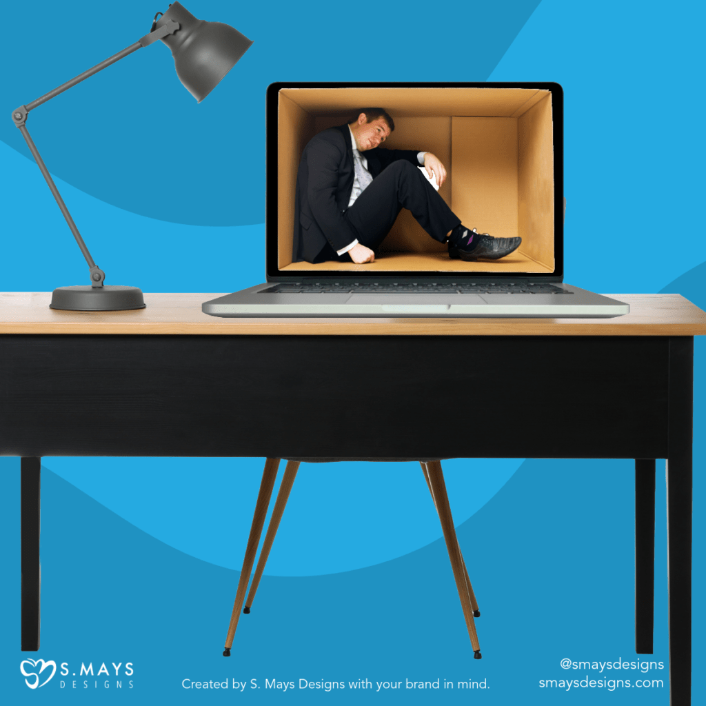 Desk with a lamp and a laptop on it on a blue background. Laptop screen is an open box with a man in a suit cramped inside